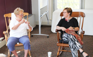 Sandy Hallman, left, chats with Jan Evans as they work on their projects.