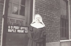 Sister Basil Pike in front of the Post Office