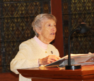 Sister Marietta Wethington A55, reads the prayers of the faithful.