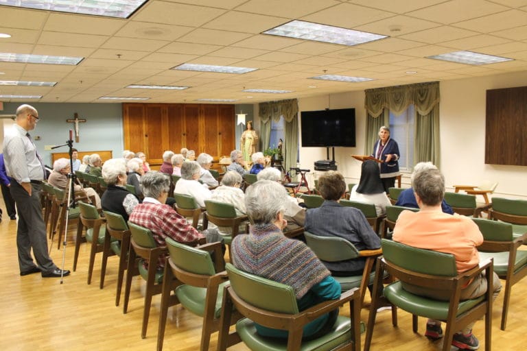 About 35 Ursuline Sisters and a few others gathered to hear Sister Mimi’s talk in the Ursula Room in Ursula Hall. At left, Dan Heckel, director of Mission Advancement and Communications, was videotaping the presentation.
