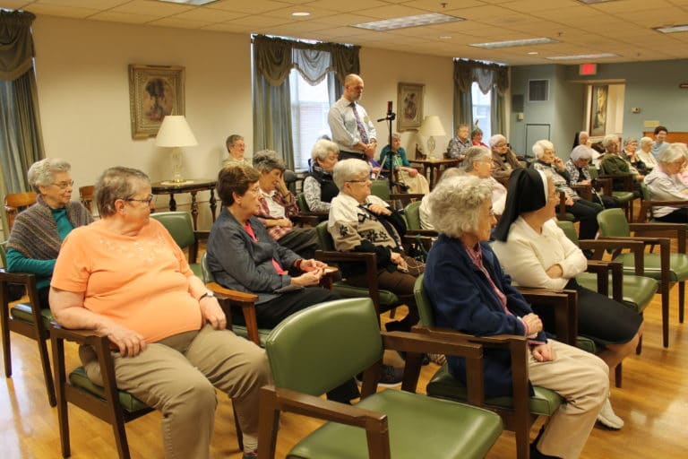 The Ursuline Sisters listen as Sister Mimi talks about recent social upheaval and protests in Chile, brought on by pensions that have been cut, increasing utility rates, and other hardships being faced by the Chilean people. She said the protests have affected everyone.