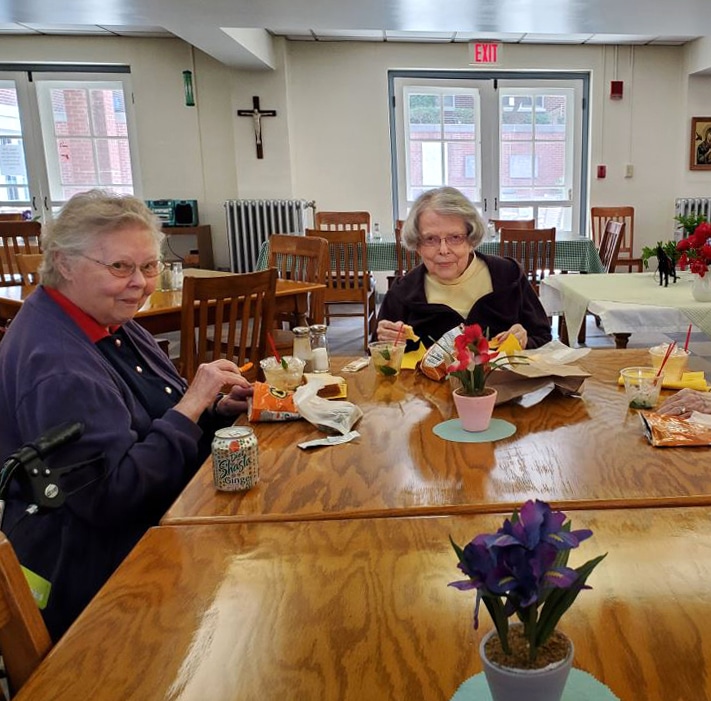 Sister Marie Joseph Coomes, left, and Sister Catherine Barber enjoy their Derby snacks. Sister Marie Joseph Coomes, left, and Sister Catherine Barber enjoy their Derby snacks.