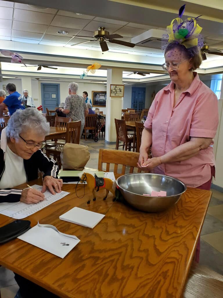 Sister Ann Patrice Cecil, left, writes down the horse drawn by Sister Rebecca White. Sister Ann Patrice Cecil, left, writes down the horse drawn by Sister Rebecca White.