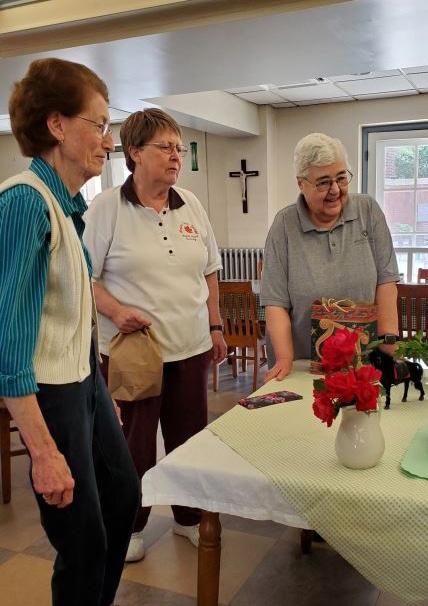 Sister Claudia Hayden, left, Sister Amelia Stenger and Sister Ann McGrew look at the Derby decorations and refreshments.