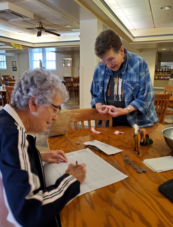 Sister Ann Patrice writes down the horse picked by Sister Sharon Sullivan. Sister Ann Patrice writes down the horse picked by Sister Sharon Sullivan.