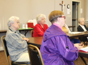 From left, Ursuline Sisters Cecelia Joseph Olinger, Francis Louise Johnson and Rebecca White listen to Sister Vivian say, “transitioning through a time of grief is a courageous journey.”