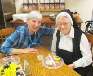 Sister Julia Head, left, spends time with Sister Joseph Angela Boone.