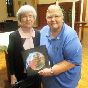 Sister Kathleen Dueber, who leaves office as a councilor on July 16, shows off her present with its creator, Sister Mary Diane Taylor.