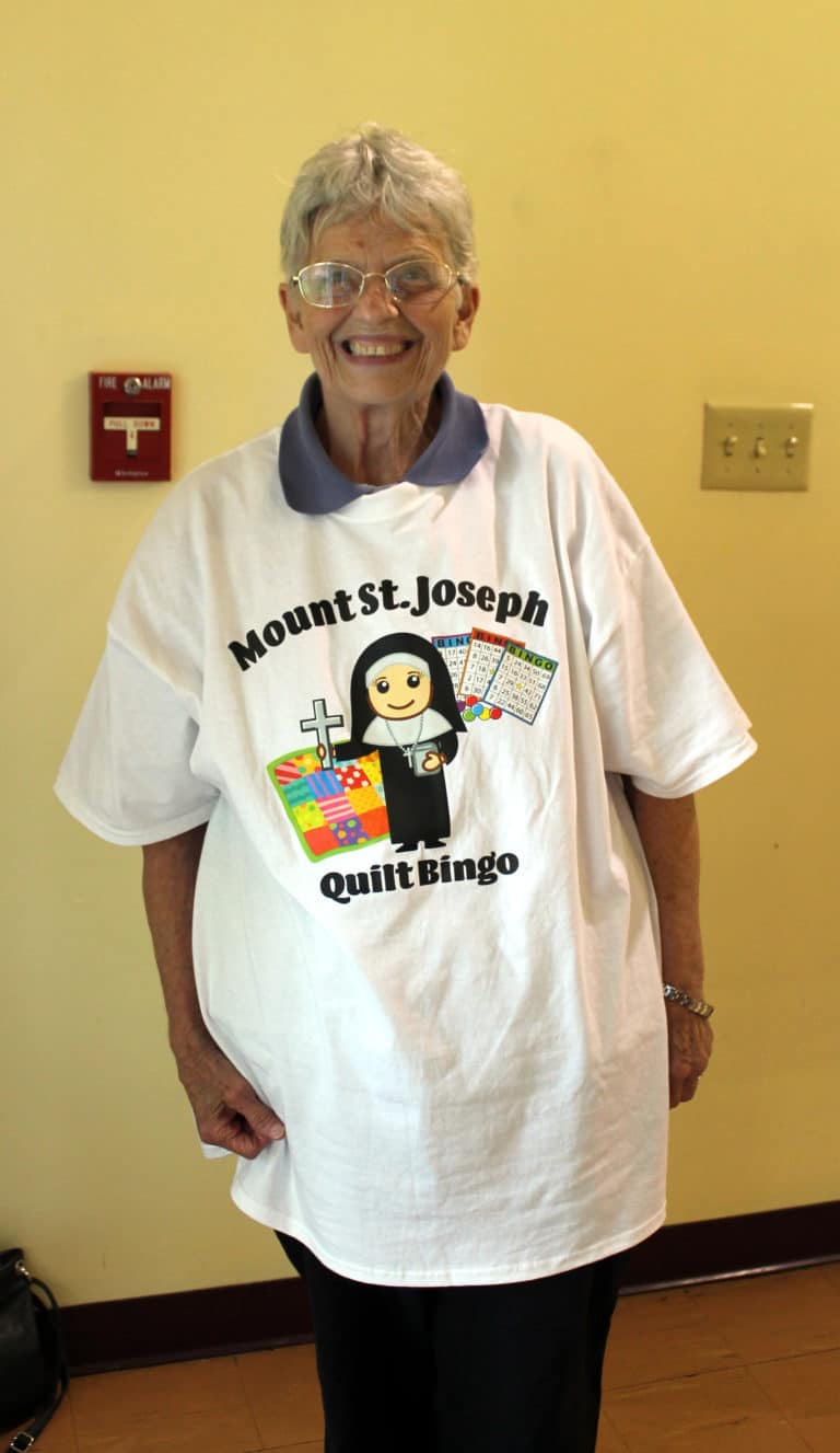 Sister Mary Celine Weidenbenner dons a Quilt Bingo T-shirt made by some of her former students.