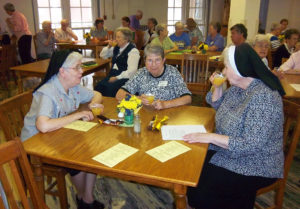 Sister Michael Ann, left, visits with Sister Clarence Marie Luckett, center, and Sister Rose Marita O’Bryan during Community Days in July 2012.