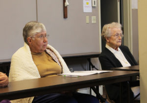 Ursuline Sisters Ruth Gehres, left, and Alfreda Malone listen to Sister Vivian talk about workshops she took with Elisabeth Kubler-Ross, the Swiss-American psychiatrist and author of “On Death and Dying.”