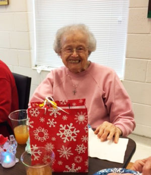 Sister Alfreda Malone is all smiles as she enjoys her treats.