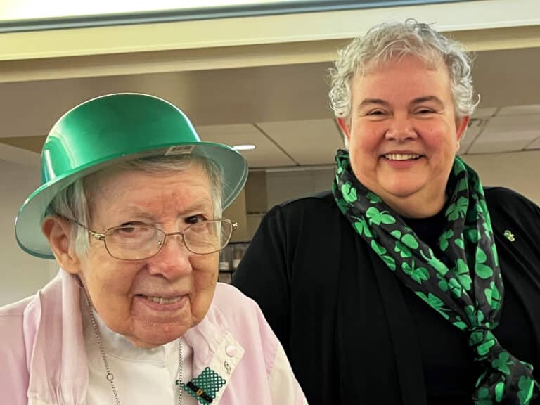 Sister Amanda Rose Mahoney, left, shares her Irish vibes with Sister Martha Keller.