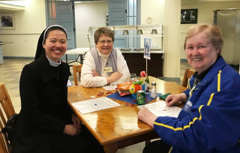 Sister Ling Thithuy Dinh, left, of the Lovers of the Holy Cross in Vietnam, joins Ursuline Sisters Amelia Stenger, center, and Helena Fischer for a day of fun.