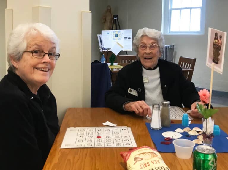 Sister Barbara Jean Head, left, and Sister Elaine Burke are ready to play. The two volunteer together at Owensboro’s RiverPark Center.