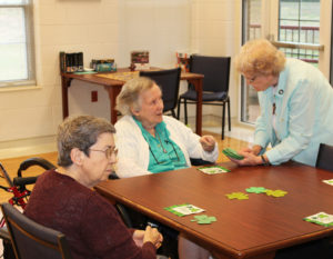 Sister Celine Leeker, center, gets ready to take a lucky number from Sister Mary Sheila Higdon, as Sister Clarence Marie Luckett looks on. The sisters later watched a short movie about Ireland.