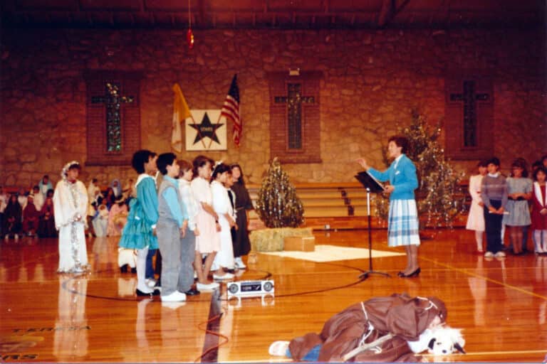 Sister Elaine Burke leads the children's choir in 1990.