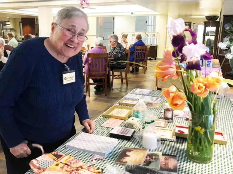 Sister Karla Kaelin peruses the gift table during the event.