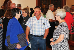 Sister Kathleen Condry, left, the new assistant congregational leader, chats with Mike Stelmach and Sister Pam Mueller following the prayer service. Mike was raised at the Mount and has worked on the Mount farm since 1978.