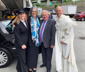 Sister Larraine poses with chauffeurs Nicole Narikian and Kenny Young, along with Father James Cuddy O.P., vice president for Mission and Ministry at Providence College.  Father Cuddy nominated Sister Larraine for the honorary degree.