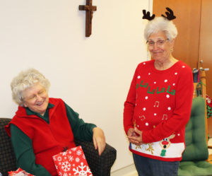Sister Francis Louise Johnson, left, and Associate Betty Boren make each other laugh during the party.