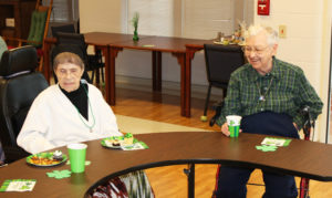 Sister Marie Bosco Wathen, right, smiles as Sister Marie Brenda Vowels decides which snack plate to start with.