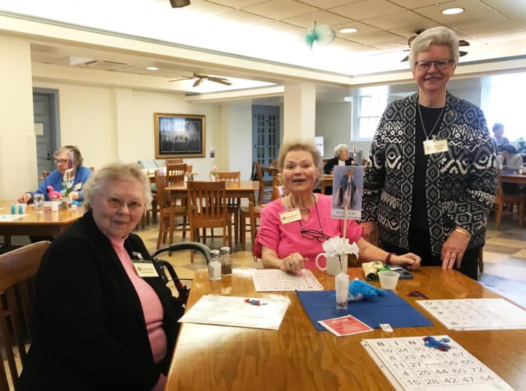 Sister Marie Joseph Coomes, left, joins Sister Alicia Coomes, center, and Sister Mary Timothy Bland for the festivities.