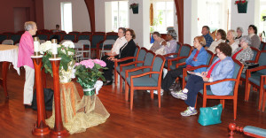 Sister Marietta Wethington speaks in the Brescia Chapel to the group that included Ursuline Sisters Amelia Stenger and Susan Mary Mudd, upper left. Centering prayer involves sitting quietly and “basking in God,” Sister Marietta said. Participants were urged to sit comfortably and focus on a prayer word. “We have no goal for centering prayer other than to be with God,” she said.