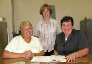 Sister Martha works closely with staff members Patti Sanders, left, and Susan Myrick, center. 