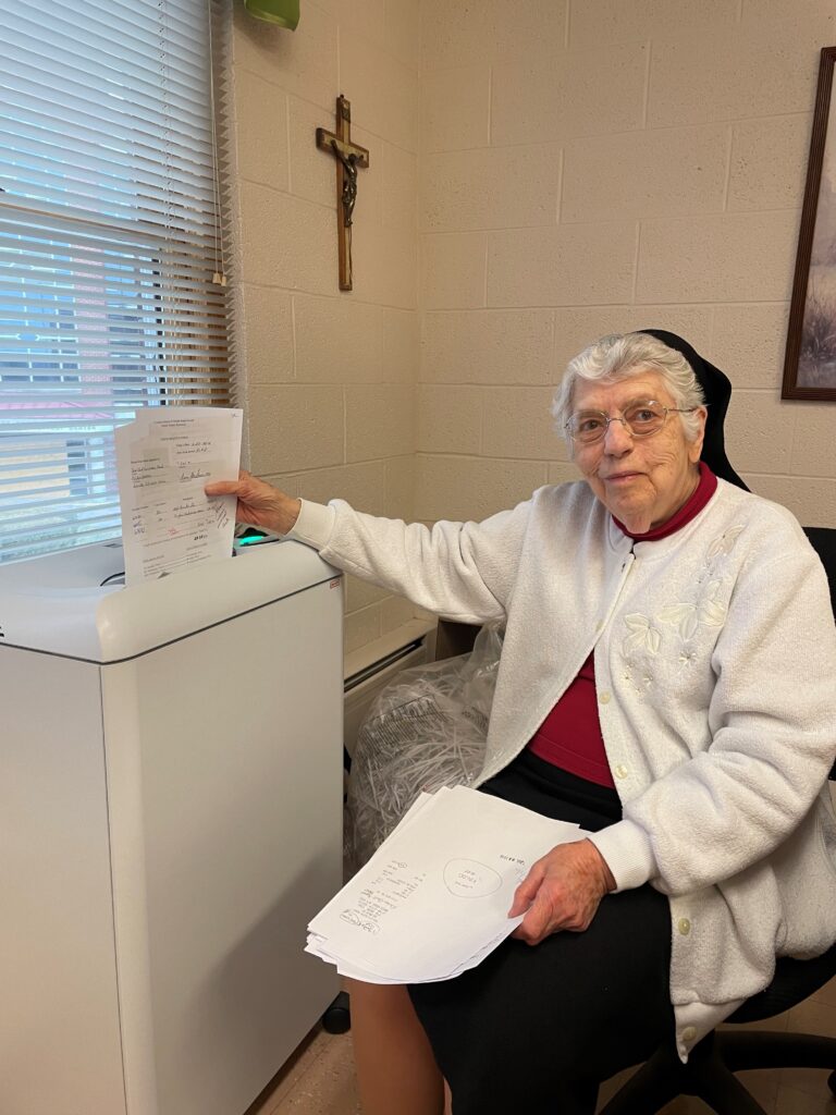 Sister Michael Ann Monaghan shreds office paper each day as part of her volunteer duties in the Motherhouse Finance office. Sister Michael Ann Monaghan shreds office paper each day as part of her volunteer duties in the Motherhouse Finance office.