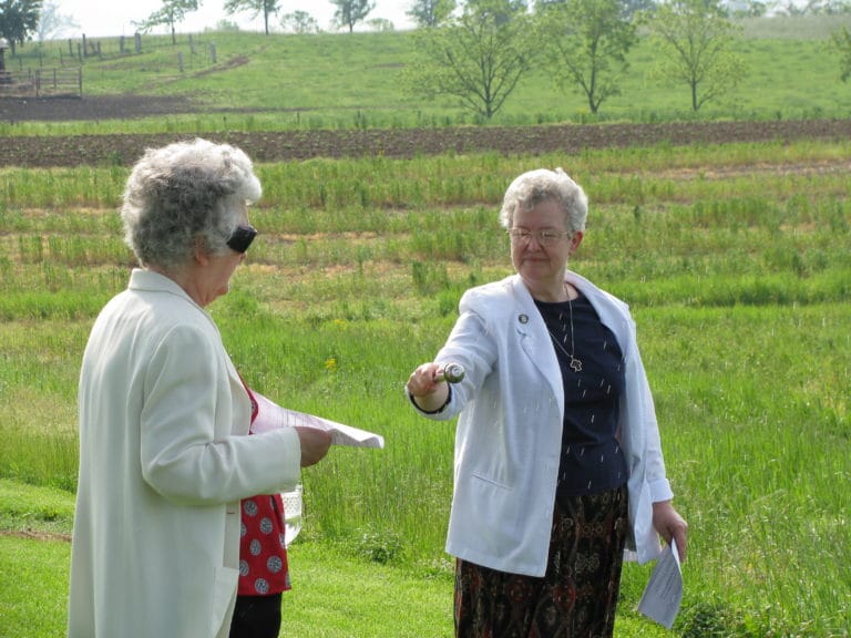 Sister Michele Morek blesses the fields at Maple Mount in 2009 when she was congregational leader.