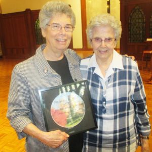 Sister Nancy Murphy, left, and Sister Naomi Aull enjoy Sister Nancy’s present.