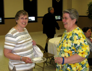 Sister Rose Jean Powers and Barbara Ann Stallings visit at the reception. Ursuline Sister Joseph Angela Boone was honored at a reception June 8, 2011, for her 22 years of service as chancellor of the Diocese of Owensboro, Ky. Stallings is the sister of Sister Helena Fischer, who lives at Brescia with Sister Rose Jean.