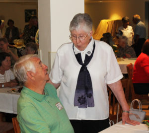 Sister Ruth Gehres talks with Ursuline Associate Mike Sullivan during the reception. Mike drove more than two hours from Paducah, Ky., to attend the event.