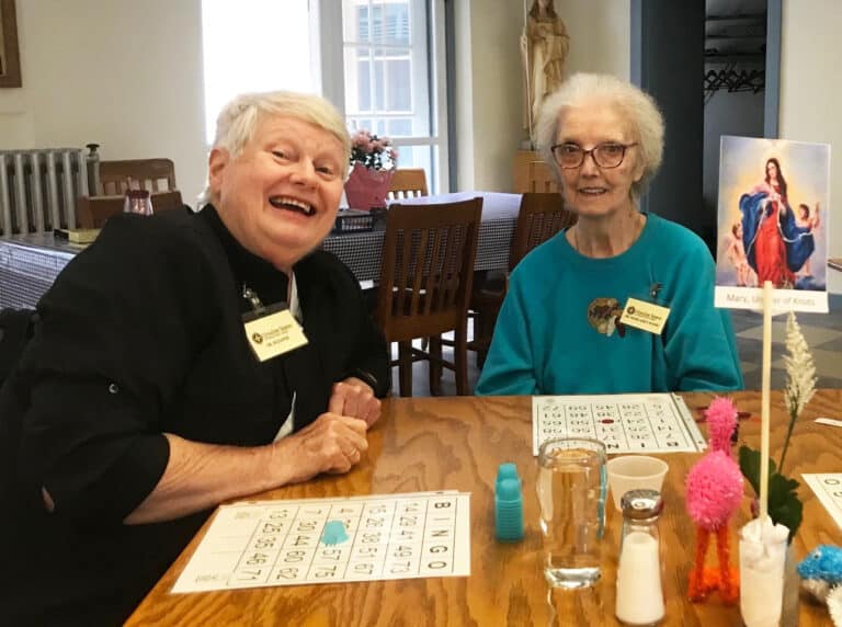 Sister Suzanne Sims, left, joins Sister Margaret Marie Greenwell for the next game.