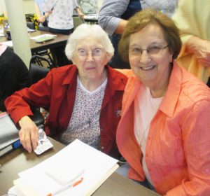 Sister Martina Rockers, left, and Sister Susan Mary Mudd keep their notes straight.