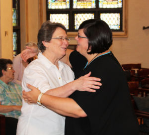 Sister Amelia Stenger hugs Sister Stephany after the ceremony. The two sisters were in the same bonded group while Sister Stephany was considering joining the Ursuline Sisters.