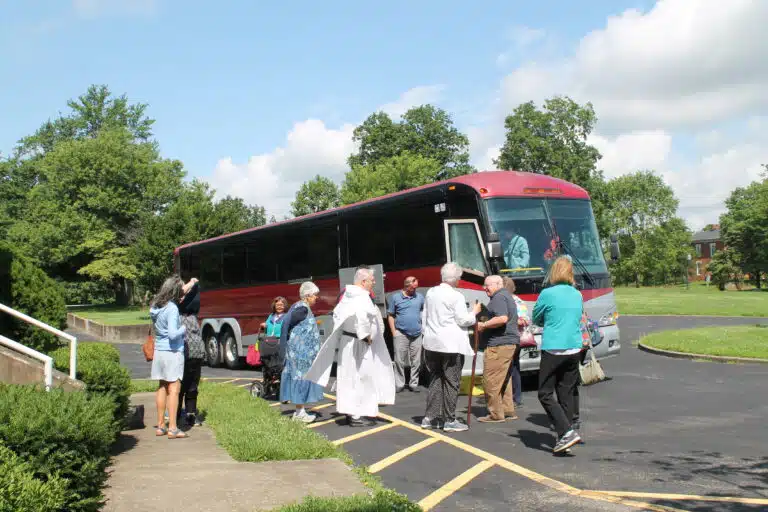 The tour bus drops off the group from Louisville in the circle near the Lourdes Building on June 19. The tour bus drops off the group from Louisville in the circle near the Lourdes Building on June 19.