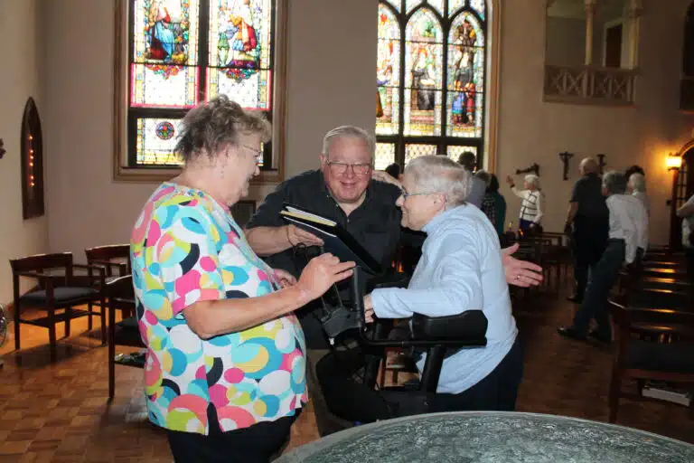 Barbara Klump, left, and her husband, Deacon Bill Klump, greet Sister Karla Kaelin in the Motherhouse Chapel. Sister Karla taught their children many years ago. Barbara Klump, left, and her husband, Deacon Bill Klump, greet Sister Karla Kaelin in the Motherhouse Chapel. Sister Karla taught their children many years ago.