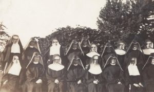 Ursuline Sisters among other students at St. Francis College in Albuquerque, New Mexico. Ursuline Sisters are Sisters Ursulita O'Bryan, Pierre Brady, Frances Xavier Miles, and Mary Joseph Peterson.