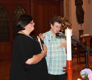Sister Sharon Sullivan tells Sister Stephany she has the support of the Ursuline community and welcomes her as a novice.