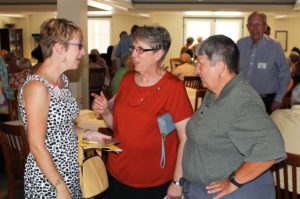 Tracy Naylor, left, vice president of institutional advancement at Brescia University, talks with Sister Betsy Moyer, center, and Ursuline Associate Mary Danhauer.