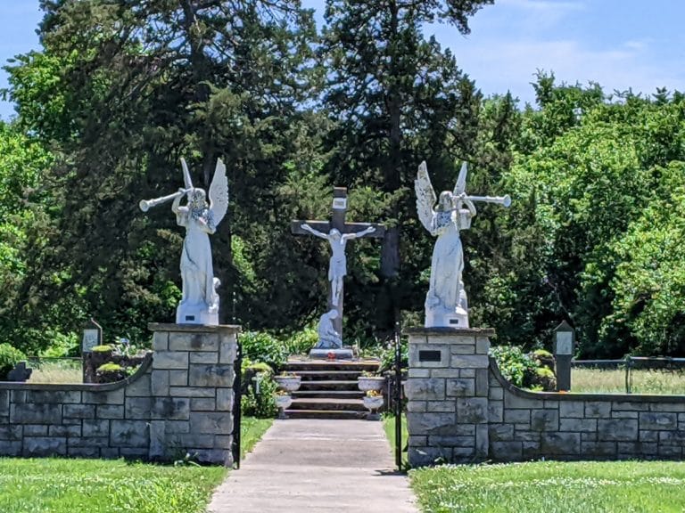 The angels welcome visitors to the Paola cemetery.