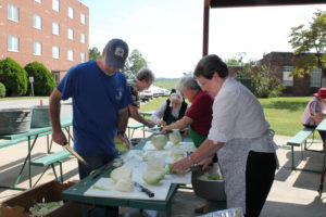 Ursuline Associate Dan Heckel, left, Sister Mary Diane Payne, Sister Joseph Angela Boone, Sister Cecelia Joseph (“CJ”) Olinger and Sister Amelia Stenger cut cabbage into chunks so it they will fit into a food chopper.