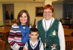Vicki Luckey, left, and her 8-year-old son Ryan, pose with Jane Irwin following lunch in the Motherhouse dining room on Dec. 15