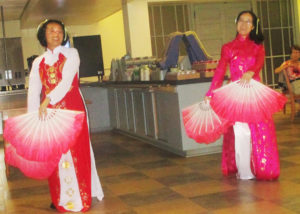 Two Sisters of the Lovers of the Holy Cross congregation from Vietnam who are staying at Maple Mount while attending Brescia University dance for the sisters July 13 in their colorful native dresses. At left is Sister Anh Tran, along with Sister Huyen Vu.