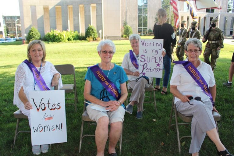 Seated in the front row from left are Susan Howard, a teacher at Brescia University in the Social Work department; Sister Barbara Jean Head, and Sister Judith Nell Riney. Seated behind them is Sister Pam Mueller holding a sign. They were on the Courthouse lawn listening to the speakers. All three Sisters minister at Brescia.