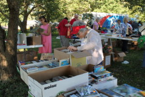 Sister Teresa Riley looks for bargains in the Yard Sale booth.