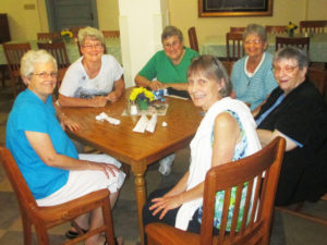These sisters are all smiles as they visit in the dining room. From left around the table are Sisters Barbara Jean Head, Pam Mueller, Karla Kaelin, Mary Celine Weidenbenner, Rosemary Keough and Kathleen Kaelin.