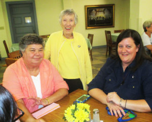 Sister Michele Ann Intravia, left, visits with Sister Marietta Wethington, center, and Sister Monica Seaton in the dining room.